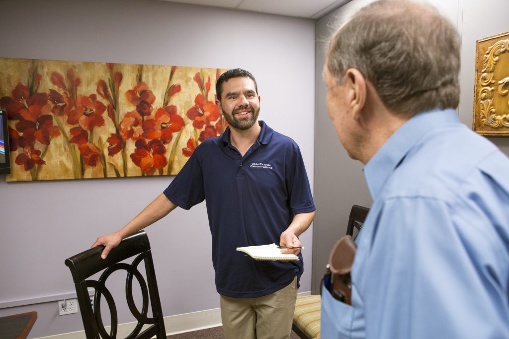 A social worker talking with a client