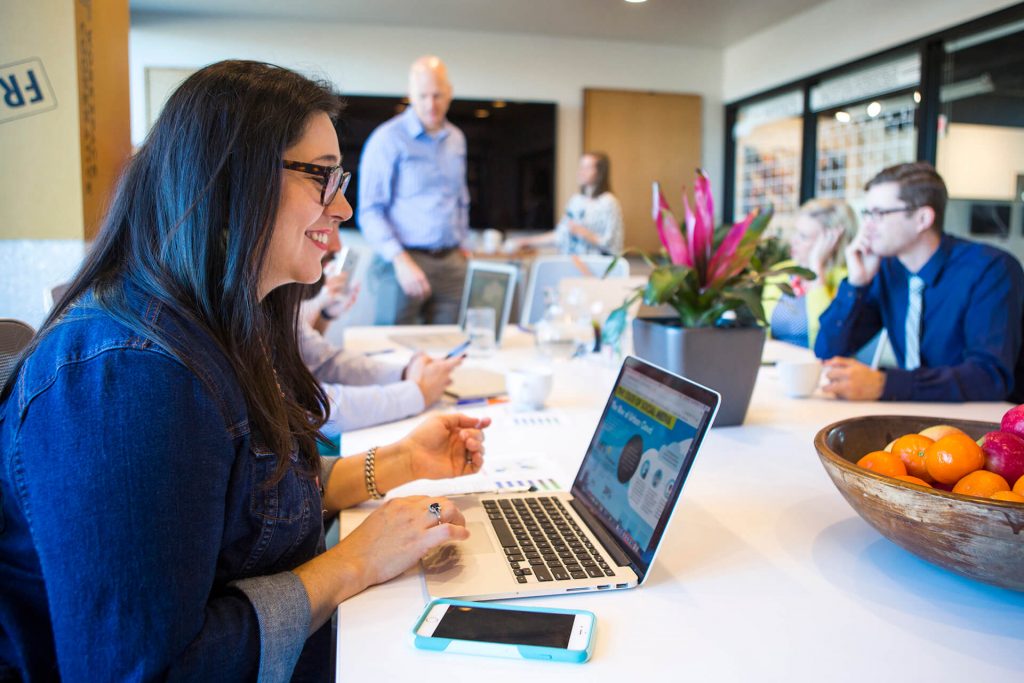 An administrative assistant taking notes during a meeting