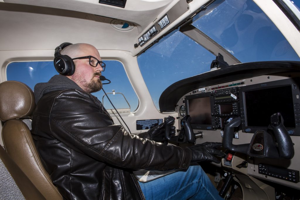 An aviation flight technology student flying a plane