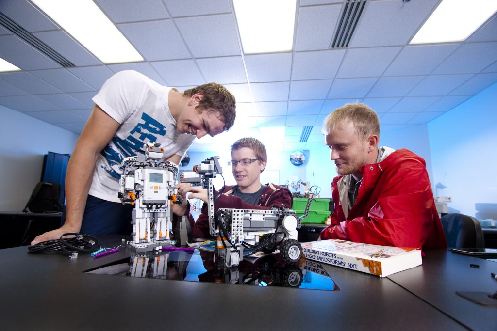 Computer science students building a pair of robots