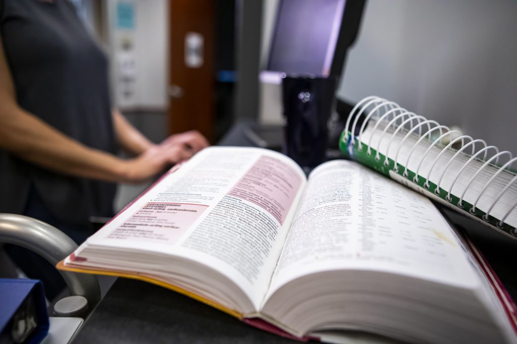 A pre-pharmacy textbook sitting on a desk