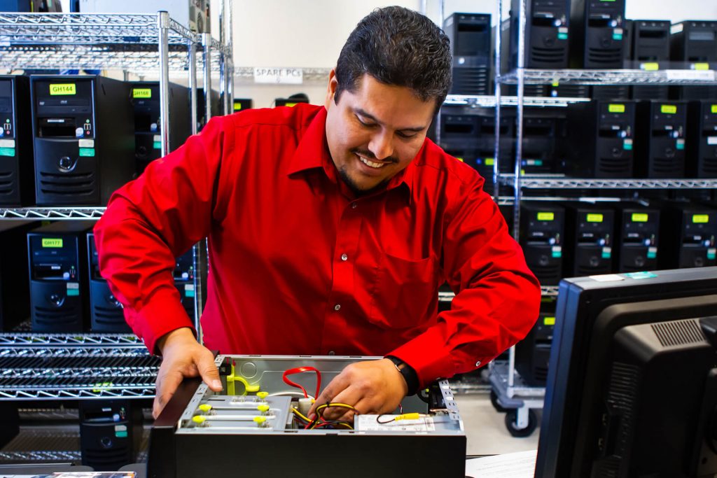 An information technology professional fixing a computer CPU