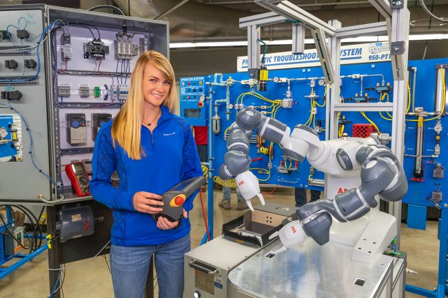 Mechatronics 1 Mechatronics student controlling a robot with a remote