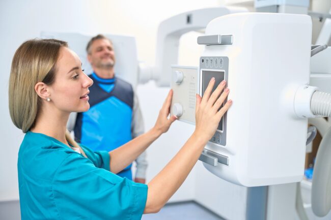 Smiling patient waiting for the x-ray machine to turn on